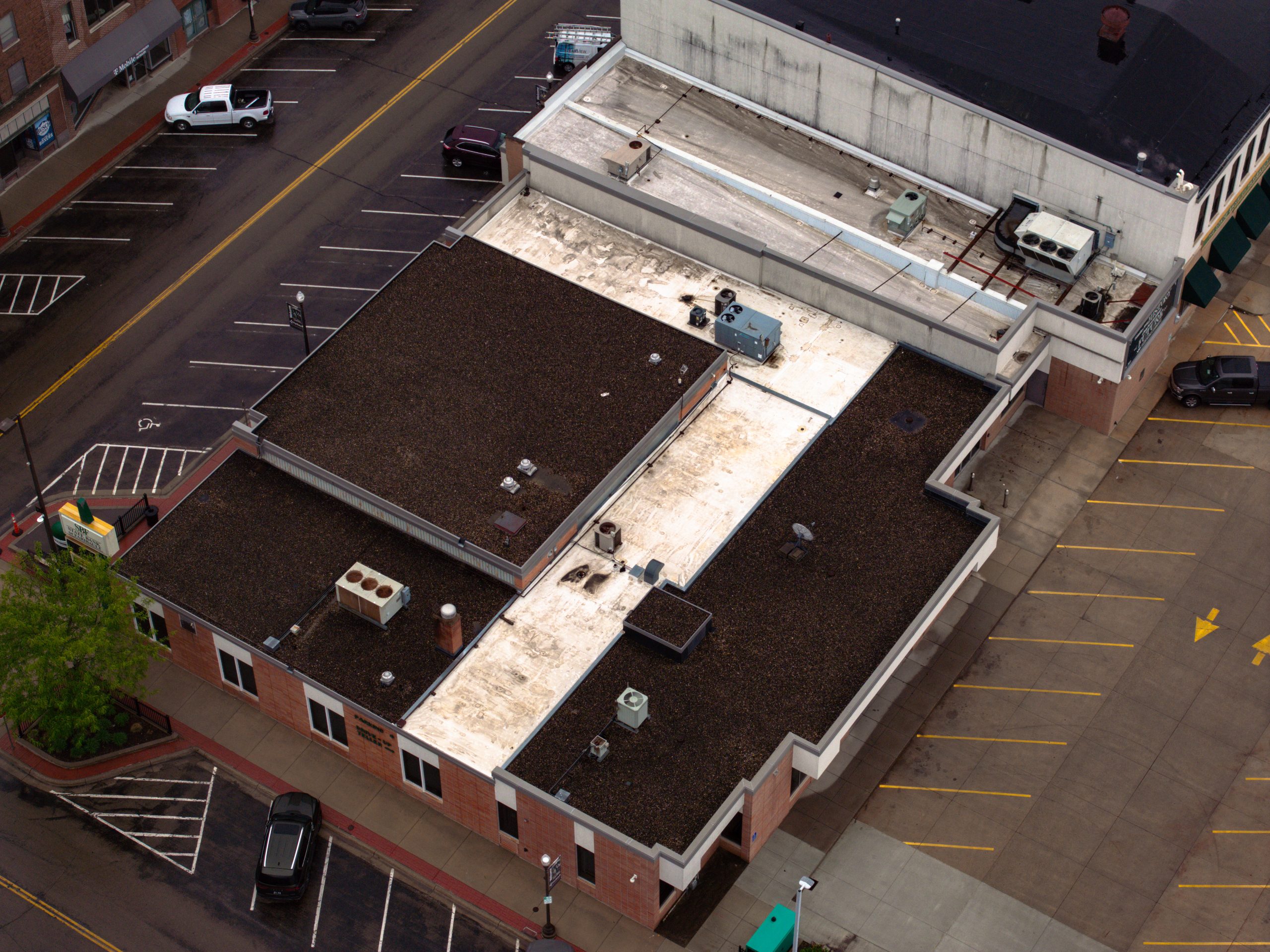 before aerial drone shot of bank roof