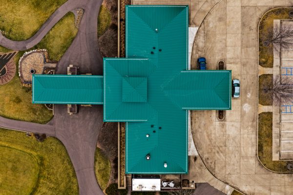 aerial of golf club's green metal roof at Dacotah Ridge Golf Course