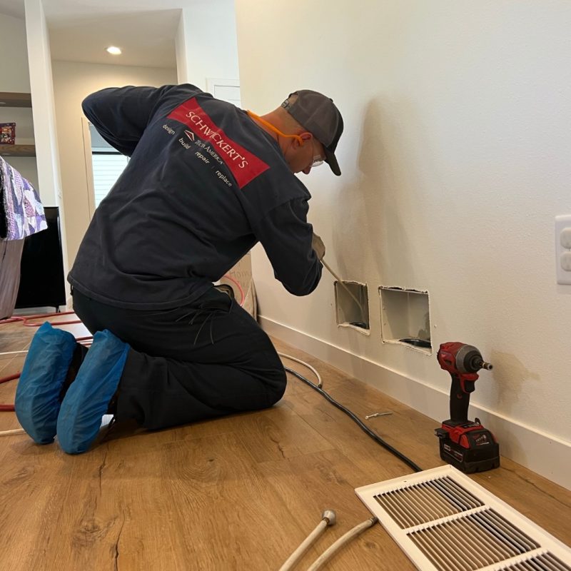 Schwickert's technician cleaning out residential air duct