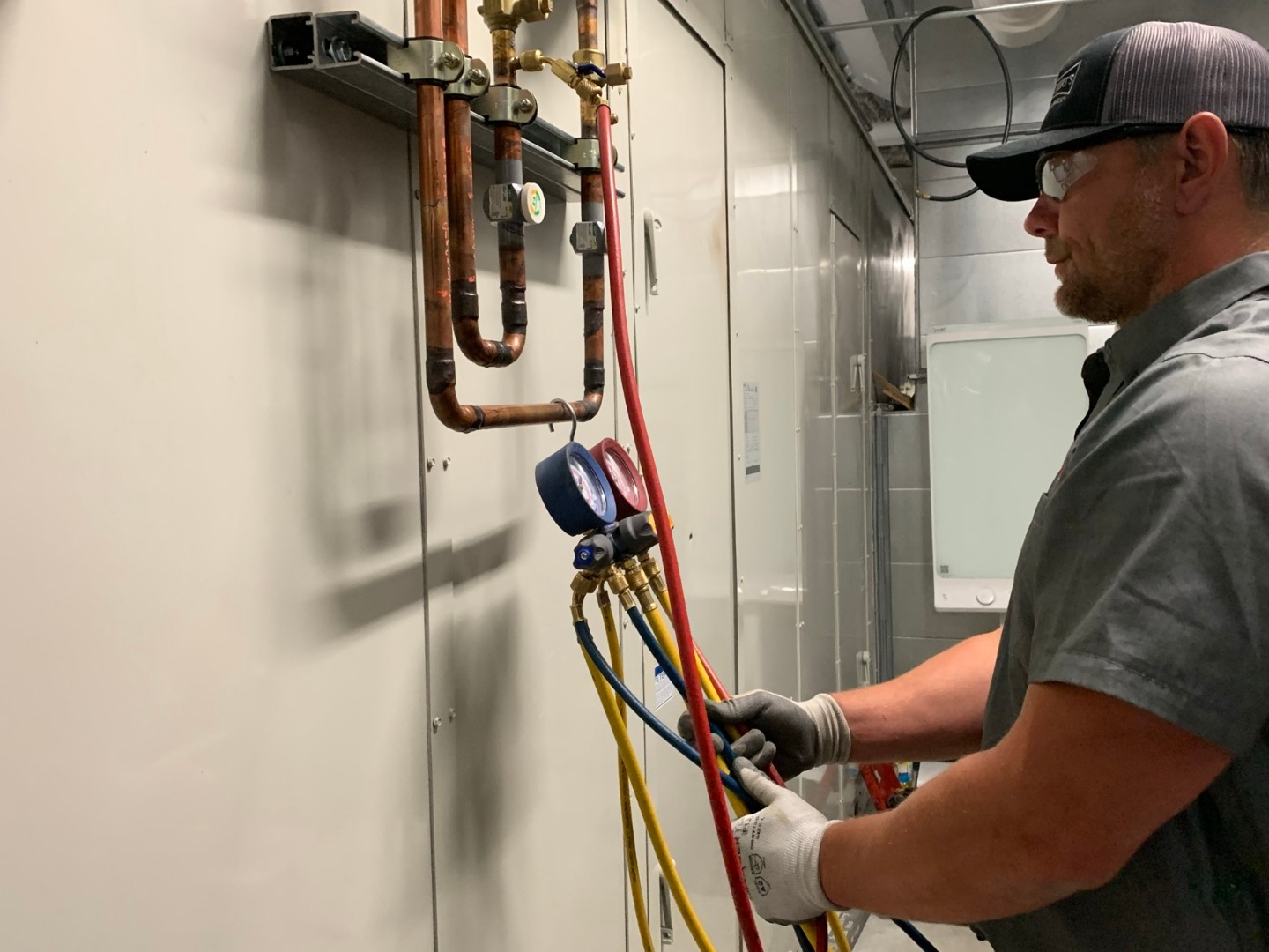 commercial HVAC-R tech reading gauge