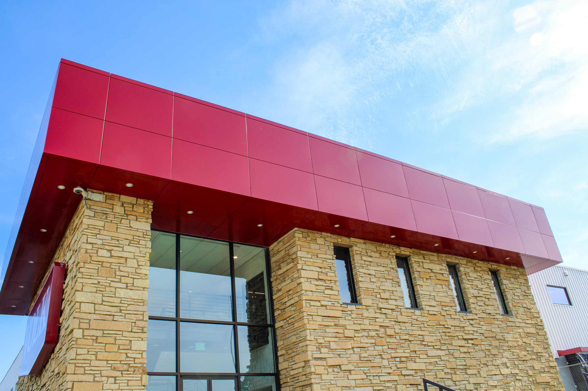 office building featuring red ACM panels