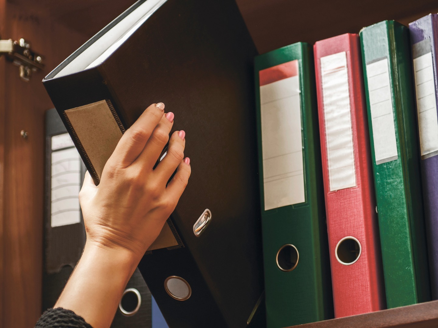 hand grabbing binders