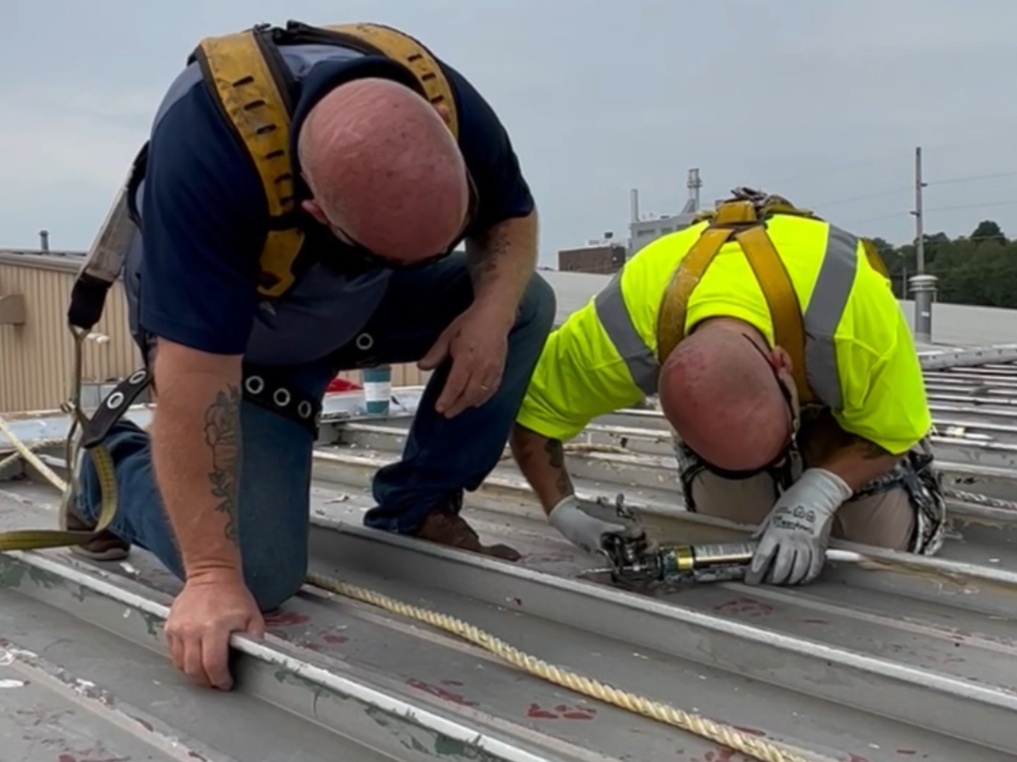 roofing service technicians on roof