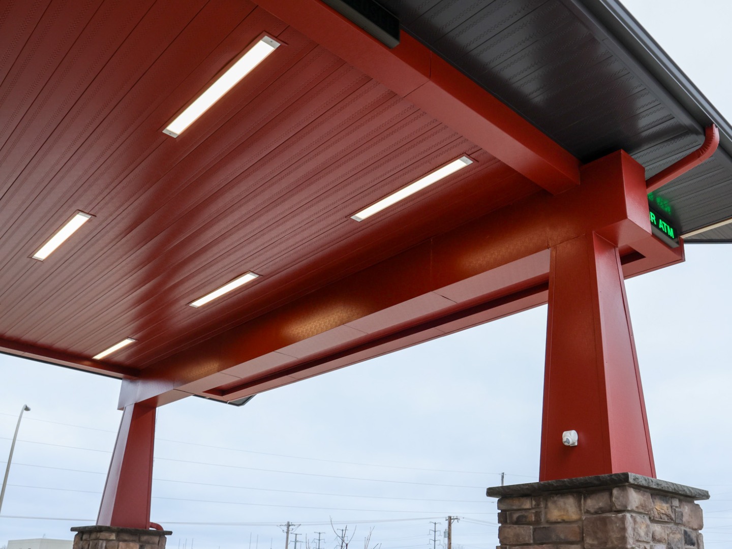 Custom red metal panels in office building drive through