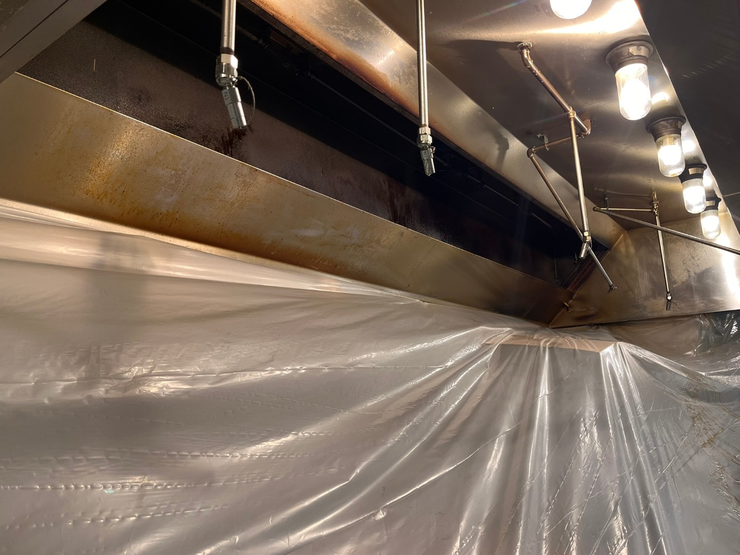 Commercial Kitchen Hood in the process of being cleaned